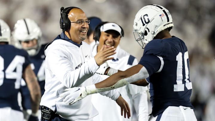 Penn State Nittany Lions head coach James Franklin celebrates with running back Nicholas Singleton during a Big Ten football game vs. the Minnesota Golden Gophers. Penn State Nittany Lions head coach James Franklin celebrates with running back Nicholas Singleton during a Big Ten football game vs. the Minnesota Golden Gophers.