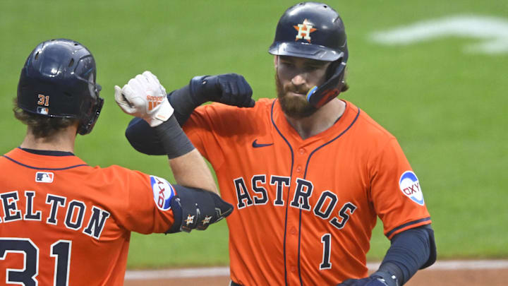 Jun 6, 2025; Cleveland, Ohio, USA; Houston Astros second baseman Brendan Rodgers (1) celebrates his solo home run with center fielder Jacob Melton (31) in the sixth inning against the Cleveland Guardians at Progressive Field. Mandatory Credit: David Richard-Imagn Images