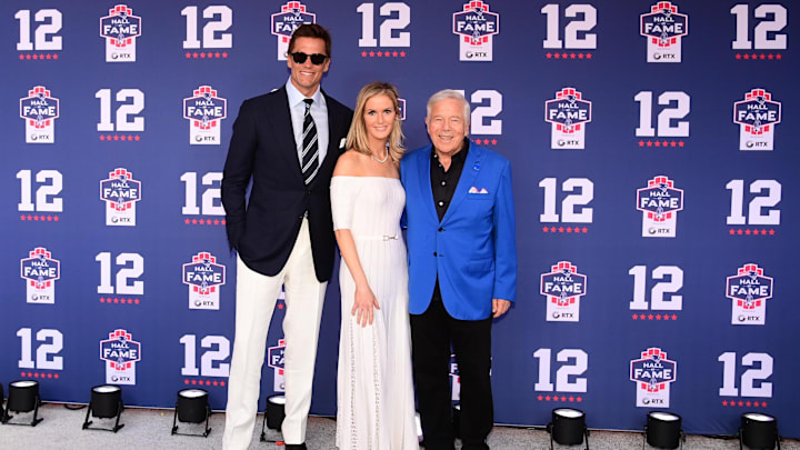 Brady poses for a photos with Kraft and his wife Dana during the New England Patriots Hall of Fame induction Ceremony for Brady.