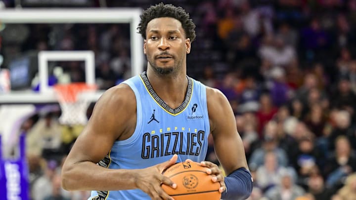 Dec 23, 2025; Salt Lake City, Utah, USA; Memphis Grizzlies forward/center Jaren Jackson Jr. (8) looks to pass around Utah Jazz center Kyle Filipowski (22) during the first half at Delta Center. 