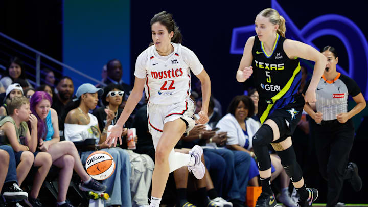 Aug 10, 2025; Arlington, Texas, USA; Washington Mystics guard Sonia Citron (22) dribbles upcourt ahead of Dallas Wings guard Paige Bueckers (5) during the first half at College Park Center. Mandatory Credit: Chris Jones-Imagn Images