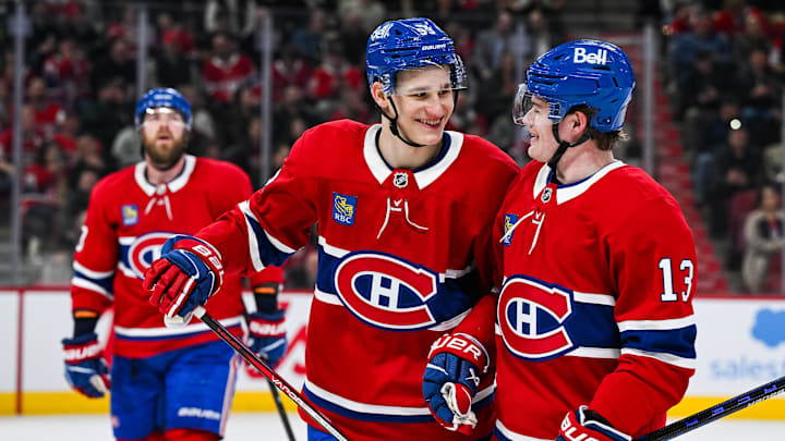 Apr 14, 2025; Montreal, Quebec, CAN; Montreal Canadiens right wing Ivan Demidov (93) celebrates with right wing Cole Caufield (13) after his first career goal against the Chicago Blackhawks in the first period at Bell Centre. Mandatory Credit: David Kirouac-Imagn Images