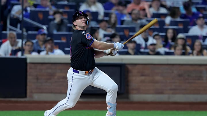 Sep 19, 2025; New York City, New York, USA; New York Mets first baseman Pete Alonso (20) follows through on a single against the Washington Nationals during the first inning at Citi Field. Mets shortstop Francisco Lindor (not pictured) scored on the play on an error by Nationals right fielder Dylan Crews (not pictured). Mandatory Credit: Brad Penner-Imagn Images