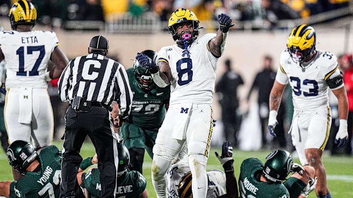 Michigan edge Derrick Moore (8) celebrates a sack against Michigan State quarterback Alessio Milivojevic (11) during the second half at Spartan Stadium in East Lansing on Saturday, October 25, 2025. Michigan edge Derrick Moore (8) celebrates a sack against Michigan State quarterback Alessio Milivojevic (11) during the second half at Spartan Stadium in East Lansing on Saturday, October 25, 2025.
