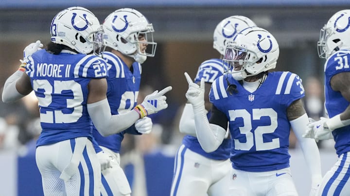 Oct 20, 2024; Indianapolis, Indiana, USA; Indianapolis Colts cornerback Kenny Moore II (23) and Indianapolis Colts safety Julian Blackmon (32) celebrate a stop during a game against the Miami Dolphins at Lucas Oil Stadium. Mandatory Credit: Grace Hollars/IndyStar USA TODAY Network via Imagn Images Oct 20, 2024; Indianapolis, Indiana, USA; Indianapolis Colts cornerback Kenny Moore II (23) and Indianapolis Colts safety Julian Blackmon (32) celebrate a stop during a game against the Miami Dolphins at Lucas Oil Stadium. Mandatory Credit: Grace Hollars/IndyStar USA TODAY Network via Imagn Images