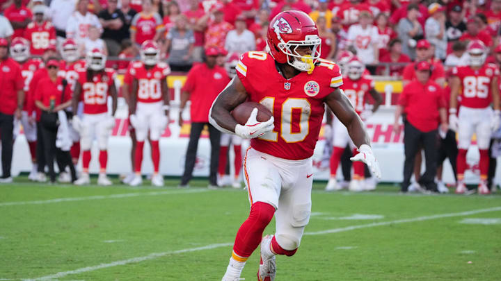Sep 28, 2025; Kansas City, Missouri, USA; Kansas City Chiefs running back Isiah Pacheco (10) runs with the ball during the fourth quarter against the Baltimore Ravens at GEHA Field at Arrowhead Stadium. Mandatory Credit: Denny Medley-Imagn Images