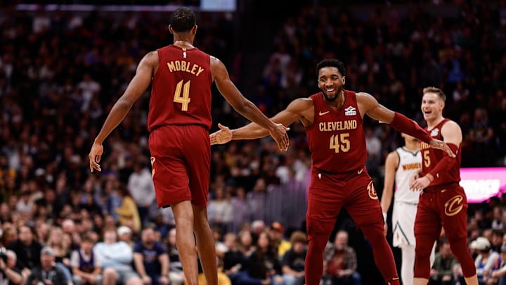 Dec 27, 2024; Denver, Colorado, USA; Cleveland Cavaliers guard Donovan Mitchell (45) reacts with forward Evan Mobley (4) after a play in the fourth quarter against the Denver Nuggets at Ball Arena. Mandatory Credit: Isaiah J. Downing-Imagn Images