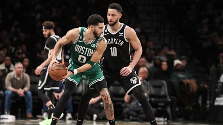 Jan 12, 2023; Brooklyn, New York, USA;  Boston Celtics forward Jayson Tatum (0) looks to post up against Brooklyn Nets guard Ben Simmons (10) in the third quarter at Barclays Center. Mandatory Credit: Wendell Cruz-Imagn Images
