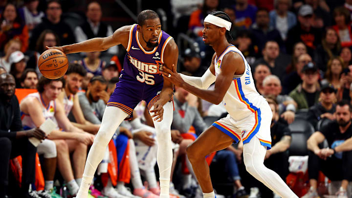 Mar 3, 2024; Phoenix, Arizona, USA; Phoenix Suns forward Kevin Durant (35) handles the ball against Oklahoma City Thunder guard Shai Gilgeous-Alexander (2) during the second quarter at Footprint Center. Mandatory Credit: Mark J. Rebilas-Imagn Images Mar 3, 2024; Phoenix, Arizona, USA; Phoenix Suns forward Kevin Durant (35) handles the ball against Oklahoma City Thunder guard Shai Gilgeous-Alexander (2) during the second quarter at Footprint Center. Mandatory Credit: Mark J. Rebilas-Imagn Images