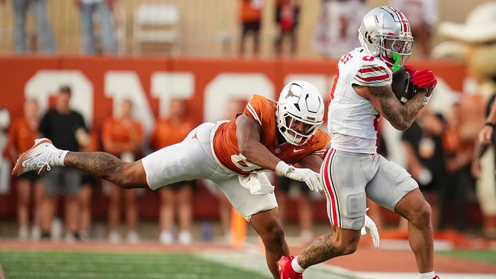 Ohio State Buckeyes wide receiver Brandon Inniss (0) returns a kick past Texas Longhorns defensive back Kade Phillips (8) during the NCAA football game at Darrell K Royal–Texas Memorial Stadium in Austin, Texas on Sept. 12, 2026. Ohio State Buckeyes wide receiver Brandon Inniss (0) returns a kick past Texas Longhorns defensive back Kade Phillips (8) during the NCAA football game at Darrell K Royal–Texas Memorial Stadium in Austin, Texas on Sept. 12, 2026.