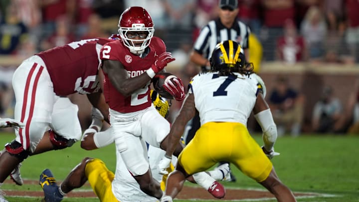 Oklahoma running back Jovantae Barnes carries the ball late in the Sooners' win over Michigan.