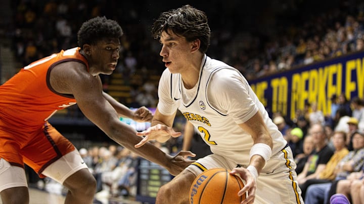 Jan 11, 2025; Berkeley, California, USA; California Golden Bears guard Andrej Stojakovic (2) dribbles the ball against Virginia Tech Hokies guard Tyler Johnson (left) during the first half at Haas Pavilion. Mandatory Credit: D. Ross Cameron-Imagn Images