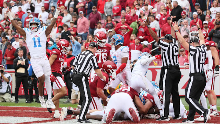 Nov 2, 2024; Fayetteville, Arkansas, USA; Ole Miss Rebels linebacker Chris Paul Jr (11) celebrates as defensive end Jared Ivey (15) falls on a loose ball in the end zone for a touchdown in the first quarter against the Arkansas Razorbacks at Donald W. Reynolds Razorback Stadium. Mandatory Credit: Nelson Chenault-Imagn Images