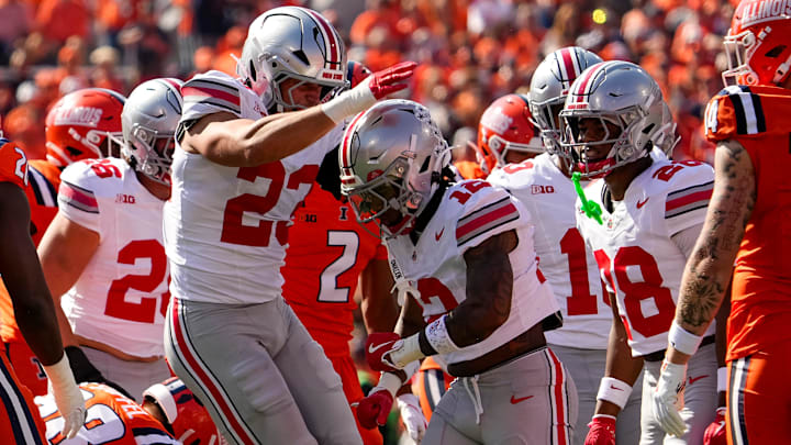 Ohio State Buckeyes linebacker Garrett Stover (23) celebrates a tackle by cornerback Bryce West (12) on a kickoff during the NCAA football game against the Illinois Fighting Illini at Gies Memorial Stadium in Champaign on Oct. 11, 2025. Ohio State won 34-16.