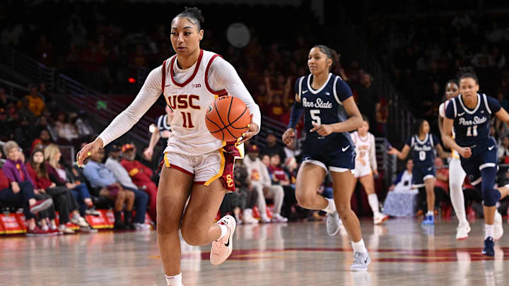 Jan 12, 2025; Los Angeles, California, USA; USC Trojans guard Kennedy Smith (11) drives the ball toward the basket as Penn State Nittany Lions forward Tamera Johnson (5) and Penn State Nittany Lions forward Ariana Williams (11) trail during the fourth quarter at Galen Center. Mandatory Credit: Robert Hanashiro-Imagn Images Jan 12, 2025; Los Angeles, California, USA; USC Trojans guard Kennedy Smith (11) drives the ball toward the basket as Penn State Nittany Lions forward Tamera Johnson (5) and Penn State Nittany Lions forward Ariana Williams (11) trail during the fourth quarter at Galen Center. Mandatory Credit: Robert Hanashiro-Imagn Images