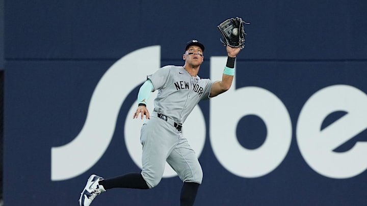 Jul 21, 2025; Toronto, Ontario, CAN; New York Yankees right fielder Aaron Judge (99) catches a fly ball for the out against the Toronto Blue Jays during the seventh inning at Rogers Centre. Mandatory Credit: Nick Turchiaro-Imagn Images
