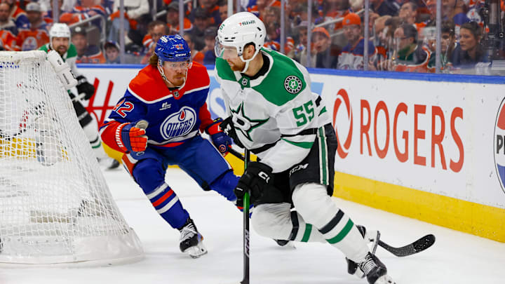 May 27, 2025; Edmonton, Alberta, CAN; Dallas Stars defenseman Thomas Harley (55) skates with the puck past Edmonton Oilers right wing Kasperi Kapanen (42) during the third period in game four of the Western Conference Final of the 2025 Stanley Cup Playoffs at Rogers Place. Mandatory Credit: Perry Nelson-Imagn Images