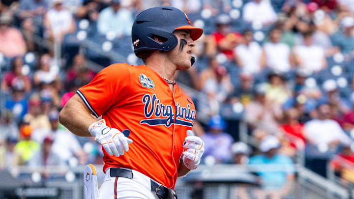 Jun 16, 2024; Omaha, NE, USA; Virginia Cavaliers second baseman Henry Godbout (2) runs after hitting a single against the Florida State Seminoles during the first inning at Charles Schwab Field Omaha. Mandatory Credit: Dylan Widger-Imagn Images