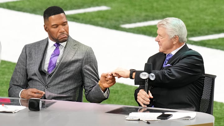 Feb 9, 2025; New Orleans, LA, USA; Fox Sports NFL Sunday analyst Michael Strahan (left) and Fox Sports NFL Sunday analyst Jimmie Johnson (right) react before Super Bowl LIX at Caesars Superdome. Mandatory Credit: Kirby Lee-Imagn Images