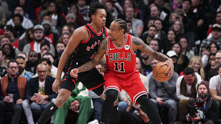 Jan 18, 2024; Toronto, Ontario, CAN; Chicago Bulls forward DeMar DeRozan (11) controls the ball as Toronto Raptors forward Scottie Barnes (4) tries to defend during the second quarter at Scotiabank Arena. Mandatory Credit: Nick Turchiaro-USA TODAY Sports