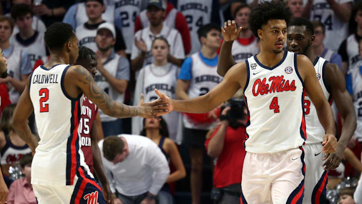 Feb 24, 2024; Oxford, Mississippi, USA; Mississippi Rebels forward Jaemyn Brakefield (4) reacts with guard TJ Caldwell (2) during the first half against the South Carolina Gamecocks at The Sandy and John Black Pavilion at Ole Miss. Mandatory Credit: Petre Thomas-Imagn Images