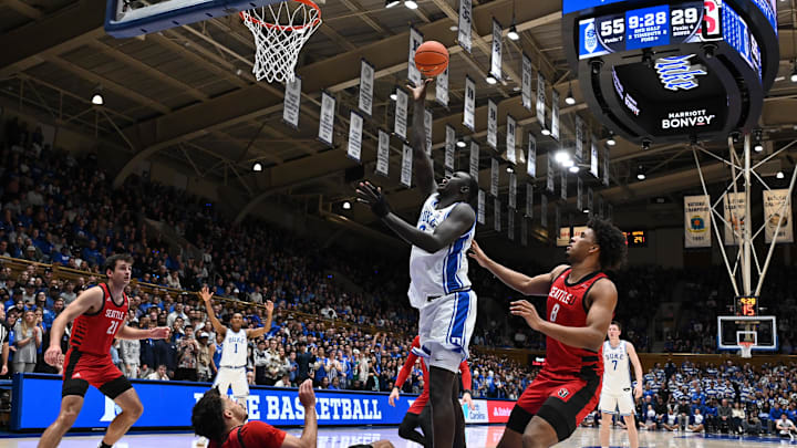 Nov 29, 2024; Durham, North Carolina, USA; Duke Blue Devils center Khaman Maluach (9) shoots over Seattle Redhawks guard Paris Dawson (2) during the second half at Cameron Indoor Stadium. Mandatory Credit: Rob Kinnan-Imagn Images