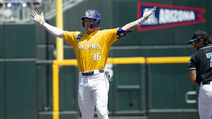 Jun 22, 2025; Omaha, Neb, USA;  LSU Tigers designated hitter Ethan Frey (16) gestures toward the bench after driving in a run with a double against the Coastal Carolina Chanticleers during the third inning at Charles Schwab Field. Mandatory Credit: Steven Branscombe-Imagn Images