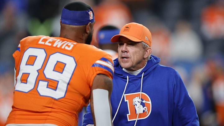 Nov 6, 2025; Denver, Colorado, USA; Denver Broncos head coach Sean Payton talks to tight end Marcedes Lewis before the game at Empower Field at Mile High. 