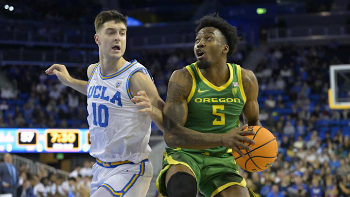 Feb 3, 2024; Los Angeles, California, USA;  UCLA Bruins guard Lazar Stefanovic (10) defends Oregon Ducks Jermain Couisnard (5).