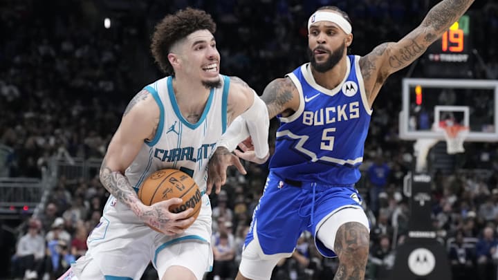Nov 23, 2024; Milwaukee, Wisconsin, USA; Charlotte Hornets guard LaMelo Ball (1) drives to the basket against Milwaukee Bucks guard Gary Trent Jr. (5) in the second half at Fiserv Forum. Mandatory Credit: Michael McLoone-Imagn Images