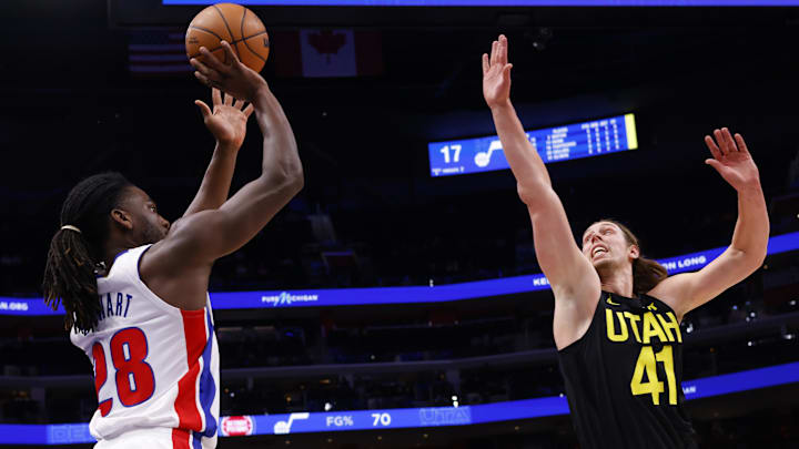 Dec 21, 2023; Detroit, Michigan, USA;  Detroit Pistons center Isaiah Stewart (28) shoots on Utah Jazz forward Kelly Olynyk (41) in the first half at Little Caesars Arena. Mandatory Credit: Rick Osentoski-Imagn Images