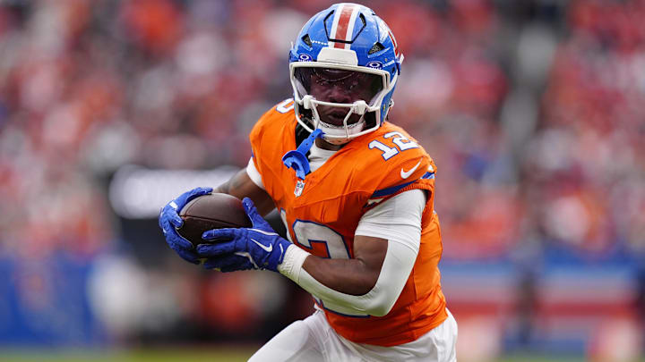 Oct 26, 2025; Denver, Colorado, USA; Denver Broncos running back RJ Harvey (12) runs against the Dallas Cowboys in the second half at Empower Field at Mile High. 