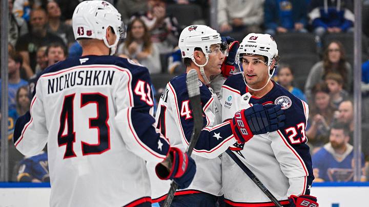 Oct 10, 2026; St. Louis, Missouri, USA; Columbus Blue Jackets center Sean Monahan (23) is congratulated by defenseman Erik Gudbranson (44) and right wing Valeri Nichushkin (43) after scoring against the St. Louis Blues during the first period at Enterprise Center. Mandatory Credit: Jeff Curry-Imagn Images