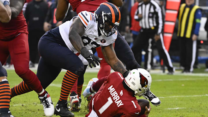 Dec 24, 2023; Chicago, Illinois, USA;  Chicago Bears defensive tackle Justin Jones (93) sacks Arizona Cardinals quarterback Kyler Murray (1) during the first half at Soldier Field. Mandatory Credit: Matt Marton-USA TODAY Sports