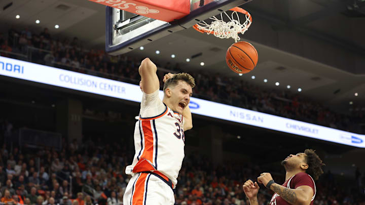 Jan 17, 2026; Auburn, Alabama, USA;  Auburn Tigers forward Filip Jovic (38) celebrates after a dunk during the second half against the South Carolina Gamecocks at Neville Arena. Mandatory Credit: John Reed-Imagn Images