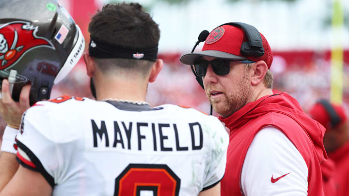 Sep 8, 2024; Tampa, Florida, USA; Tampa Bay Buccaneers quarterback Baker Mayfield (6) talks with offensive coordinator Liam Coen against the Washington Commanders during the first half at Raymond James Stadium. Mandatory Credit: Kim Klement Neitzel-Imagn Images Sep 8, 2024; Tampa, Florida, USA; Tampa Bay Buccaneers quarterback Baker Mayfield (6) talks with offensive coordinator Liam Coen against the Washington Commanders during the first half at Raymond James Stadium. Mandatory Credit: Kim Klement Neitzel-Imagn Images