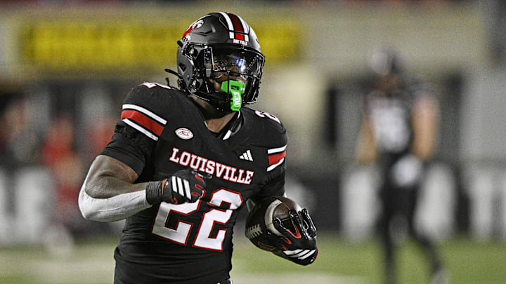 Oct 25, 2025; Louisville, Kentucky, USA;  Louisville Cardinals running back Keyjuan Brown (22) runs the ball for a touchdown against the Boston College Eagles during the second half at L&N Federal Credit Union Stadium.  Mandatory Credit: Jamie Rhodes-Imagn Images
