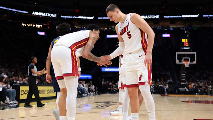 Dec 29, 2025; Miami, Florida, USA; Miami Heat forward Nikola Jovic (5) and center Kel'El Ware (7) shake hands during the third quarter against the Denver Nuggets at Kaseya Center. Mandatory Credit: Sam Navarro-Imagn Images