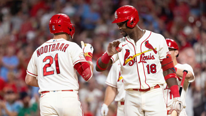 Sep 30, 2023; St. Louis, Missouri, USA; St. Louis Cardinals right fielder Jordan Walker (18) celebrates with his teammate St. Louis Cardinals center fielder Lars Nootbaar (21) for his homerun against the Cincinnati Reds in the second inning at Busch Stadium. Mandatory Credit: Zach Dalin-USA TODAY Sports