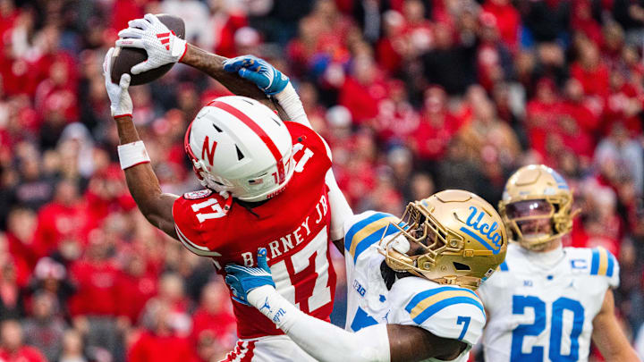 Nov 2, 2024; Lincoln, Nebraska, USA; Nebraska Cornhuskers wide receiver Jacory Barney Jr. (17) makes a catch against UCLA Bruins defensive back K.J. Wallace (7) during the third quarter at Memorial Stadium. 