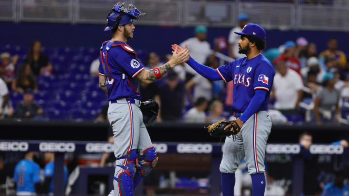 Jun 2, 2024; Miami, Florida, USA; Texas Rangers relief pitcher Grant Anderson (65) celebrates with catcher Jonah Heim (28) after the game against the Miami Marlins at loanDepot Park. 