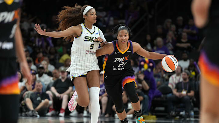 May 27, 2025; Phoenix, Arizona, USA; Phoenix Mercury forward Alyssa Thomas (25) drives around Chicago Sky forward Angel Reese (5) in the second half at Footprint Center. Mandatory Credit: Rick Scuteri-Imagn Images