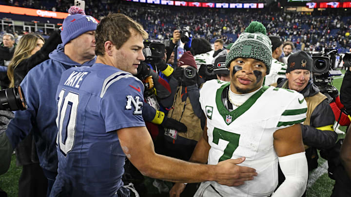 Nov 13, 2025; Foxborough, Massachusetts, USA; New England Patriots quarterback Drake Maye (10) and New York Jets quarterback Justin Fields (7) react after the game at Gillette Stadium. Mandatory Credit: Eric Canha-Imagn Images