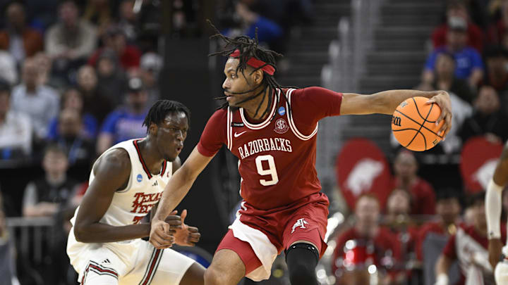 Mar 27, 2025; San Francisco, CA, USA; Arkansas Razorbacks forward Jonas Aidoo (9) dribbles past Texas Tech Red Raiders forward Federiko Federiko (33) during the second half during a West Regional semifinal of the 2025 NCAA tournament at Chase Center. Mandatory Credit: Eakin Howard-Imagn Images