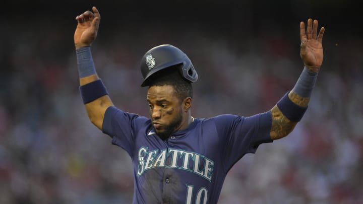 The Seattle Mariners' Victor Robles gets back to first against the Los Angeles Angels on Saturday at Anaheim Stadium.