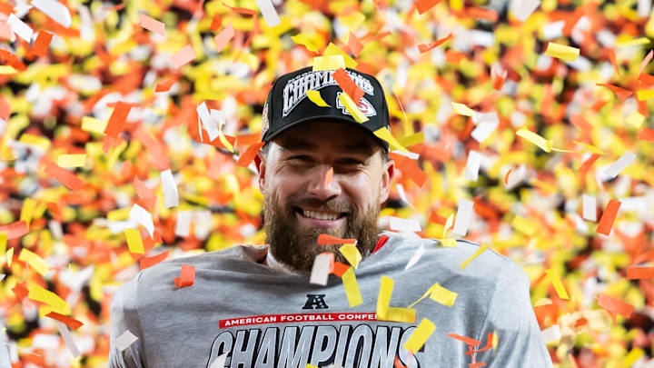 Jan 26, 2025; Kansas City, MO, USA; Confetti falls as Kansas City Chiefs tight end Travis Kelce (87) celebrates after defeating the Buffalo Bills during the AFC Championship game at GEHA Field at Arrowhead Stadium. Mandatory Credit: Mark J. Rebilas-Imagn Images