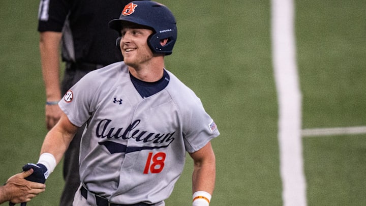 Auburn Tigers catcher Ike Irish (18) runs from third base to home to score a run for the Tigers in the third inning as the Texas Longhorns take on the Auburn in the first game of a three-game series on Thursday night at UFCU Disch-Falk Field in Austin, April 17, 2025. Auburn Tigers catcher Ike Irish (18) runs from third base to home to score a run for the Tigers in the third inning as the Texas Longhorns take on the Auburn in the first game of a three-game series on Thursday night at UFCU Disch-Falk Field in Austin, April 17, 2025.