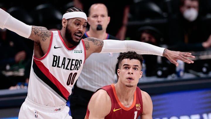 May 24, 2021; Denver, Colorado, USA; Denver Nuggets forward Michael Porter Jr. (1) looks to shoot under pressure from Portland Trail Blazers forward Carmelo Anthony (00) in the first quarter during game two in the first round of the 2021 NBA Playoffs at Ball Arena. Mandatory Credit: Isaiah J. Downing-Imagn Images