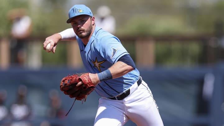 Mar 10, 2026; Port Charlotte, Florida, USA; Tampa Bay Rays second baseman Gavin Lux (11) throws to first few an out against the Minnesota Twins in the second inning during spring training at Charlotte Sports Park. Mandatory Credit: Nathan Ray Seebeck-Imagn Images