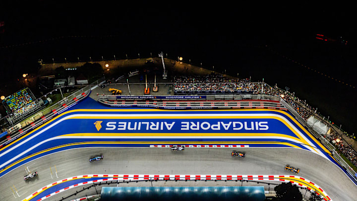 SEPTEMBER 17: (L-R) Nico Hulkenberg of Germany driving the (27) Haas F1 VF-23 Ferrari, Pierre Gasly of France driving the (10) Alpine F1 A523 Renault, Logan Sargeant of United States driving the (2) Williams FW45 Mercedes, Sergio Perez of Mexico driving the (11) Oracle Red Bull Racing RB19 and Oscar Piastri of Australia driving the (81) McLaren MCL60 Mercedes during the F1 Grand Prix of Singapore at Marina Bay Street Circuit on September 17, 2023. (Photo by Clive Rose/Getty Images) SEPTEMBER 17: (L-R) Nico Hulkenberg of Germany driving the (27) Haas F1 VF-23 Ferrari, Pierre Gasly of France driving the (10) Alpine F1 A523 Renault, Logan Sargeant of United States driving the (2) Williams FW45 Mercedes, Sergio Perez of Mexico driving the (11) Oracle Red Bull Racing RB19 and Oscar Piastri of Australia driving the (81) McLaren MCL60 Mercedes during the F1 Grand Prix of Singapore at Marina Bay Street Circuit on September 17, 2023. (Photo by Clive Rose/Getty Images)